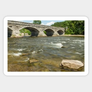 The flowing waters and the bridge Sticker